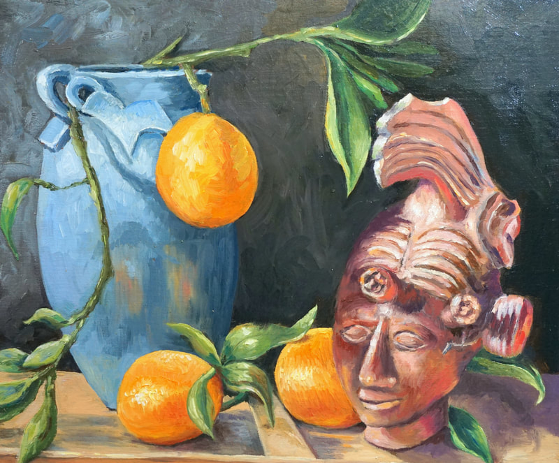Still life with Mayan statue, blue vase, and oranges. 